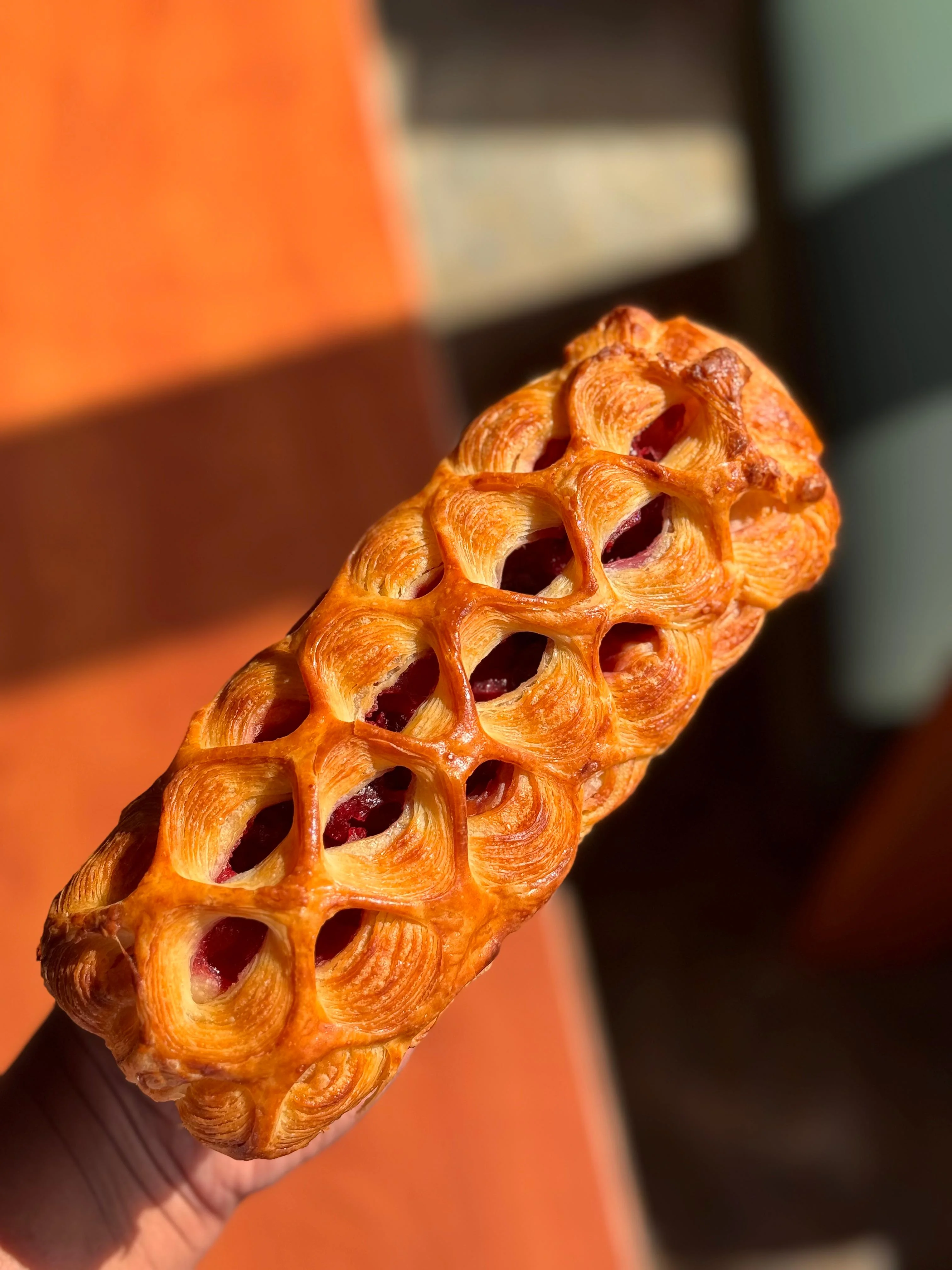La Résille — feuilletage beurre scored in a honeycomb lattice, filled with sour cherry compote and burnished to amber